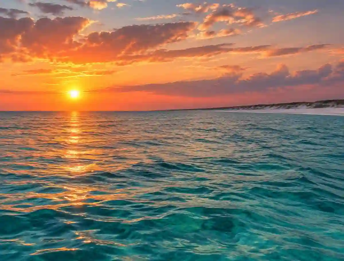 Golden sunset reflecting across the turquoise Gulf near Destin